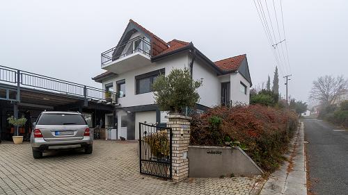 33447 A family house with an ever and unique panorama is for sale in Vonyarcvashegy. There is a beautiful view of the St. Michael's Hill and St. Michael's Chapel as well.