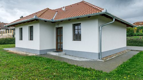33503 A family house is for sale in a wonderful, quiet environment, partly with a panorama of the Lake Balaton. The house can be financed by low monthly costs. 