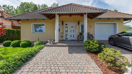 33537 It is a beautiful and tasteful, discreet family house for sale a few minutes away from the shoreline of lake Balaton.