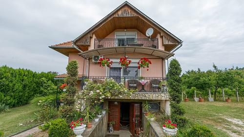 33588 It is a family house for sale, located in a quiet street, close to the forest and the shoreline of Lake Balaton.