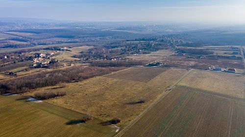 77436 The 2 plots together are 19,998 square meters (1 + 1 hectare). 
Gas, water, electricity - these public utilities are available in the street, in front of the plot. The canalization of sewage water can be solved inside the boundaries of the plot. 